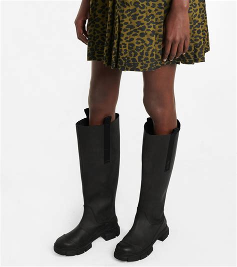 ganni rubber knee high boots.